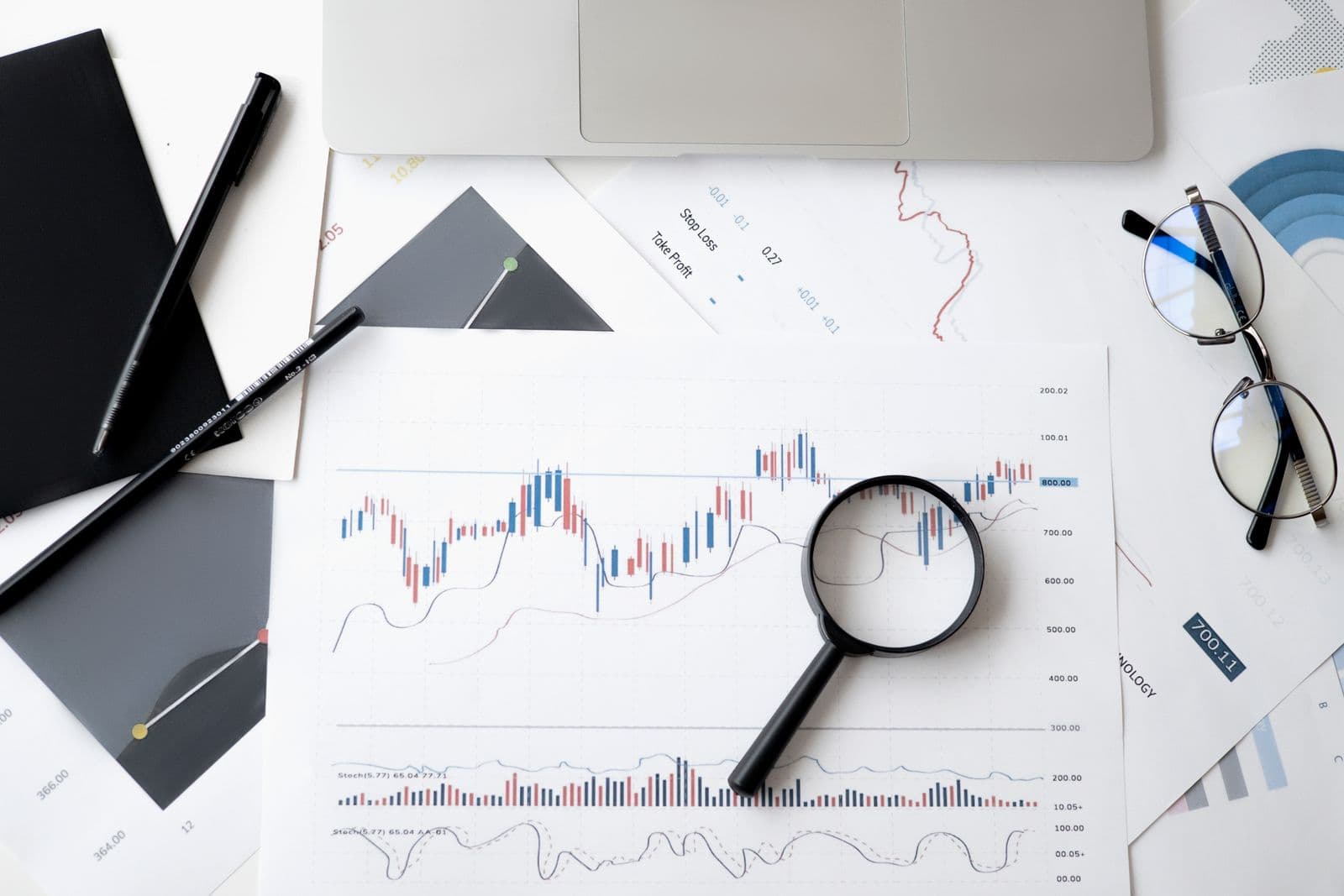 Magnifying glass over a financial document, representing chargeback dispute review